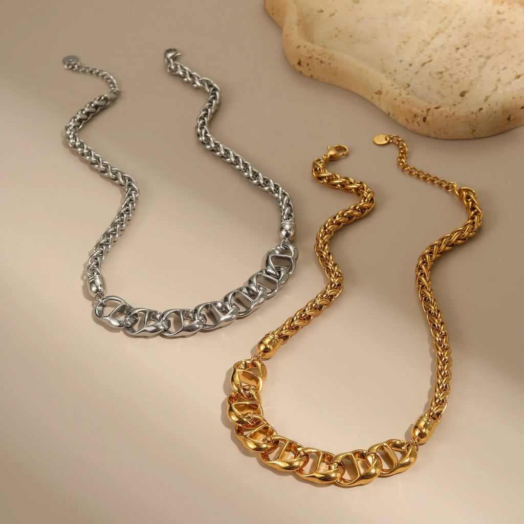 Gold plated stainless steel geometric chain necklace for women on a white background.