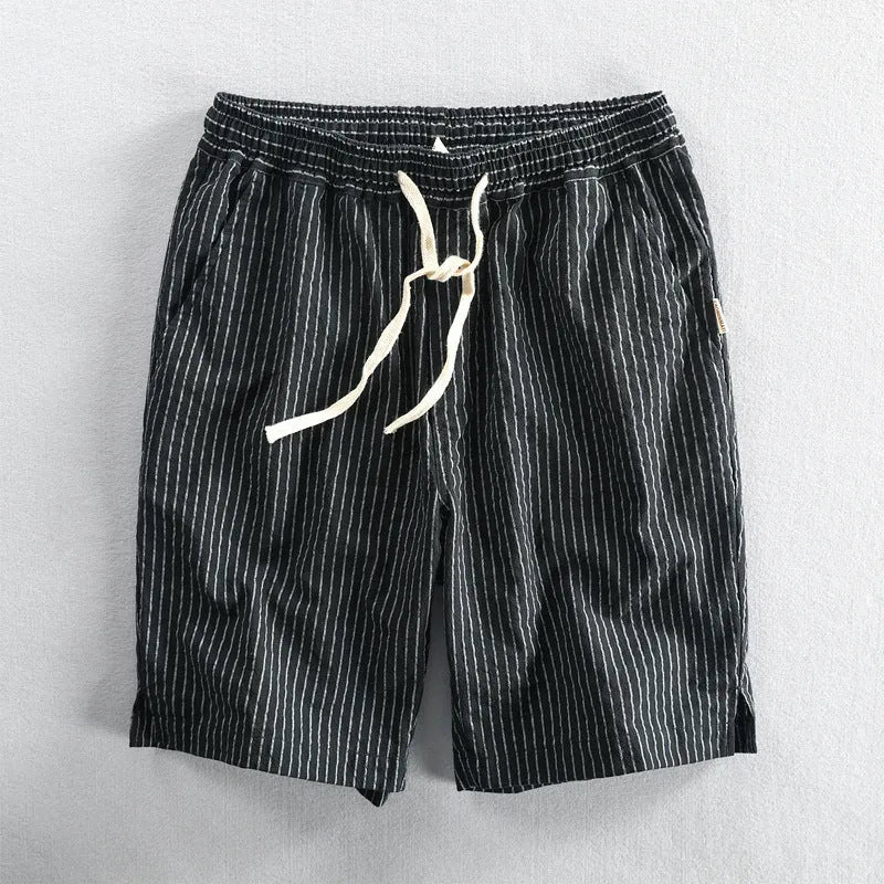 Men's striped cotton casual loose shorts on a hanger showing mid waist and shorts length.