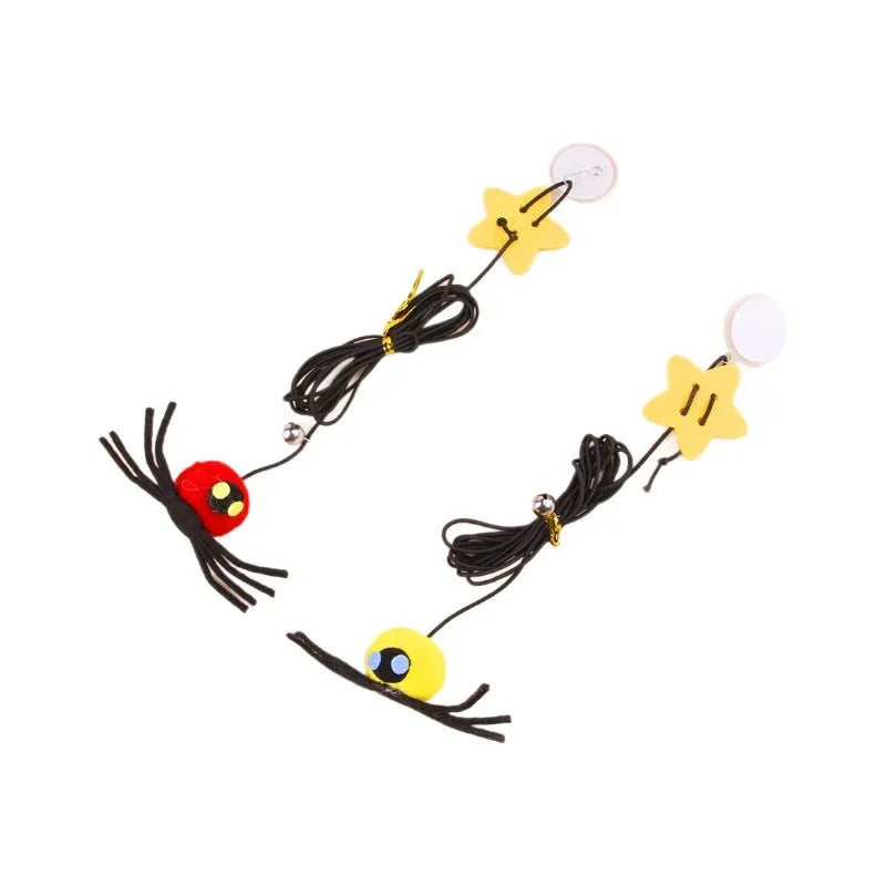 Red and yellow door-hanging cat toy with elastic rope, feather, bell and spider attachment for indoor feline play