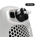 White ceramic heating electric hot air blower heater with remote control on a table.
