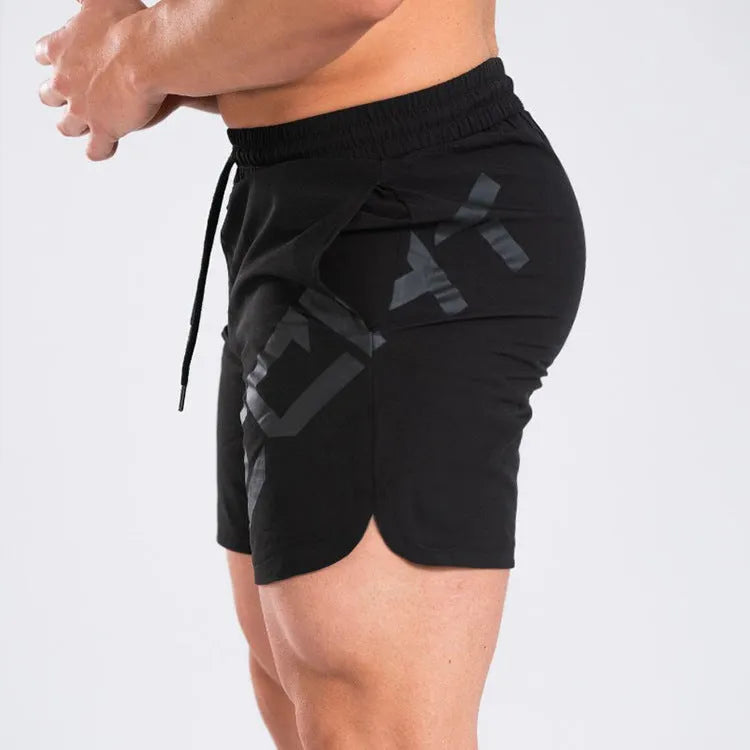 Men's black elastic waist knee-length quick-dry training shorts on a white background.
