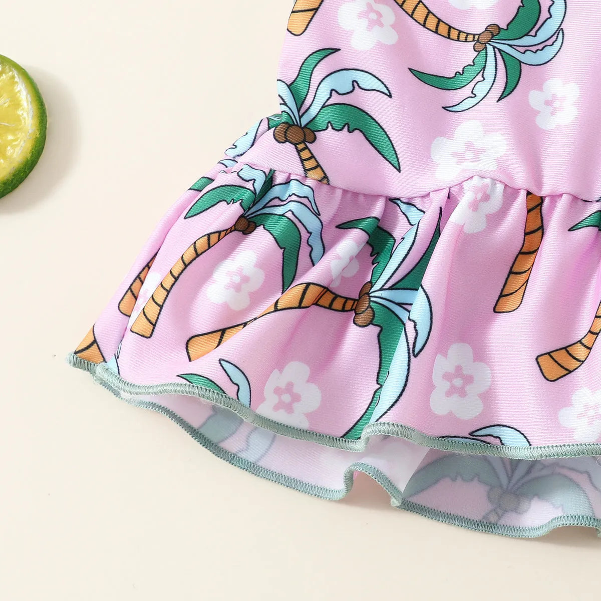 White sweet style girls' two-piece swimsuit set with shirt top and beach shorts on a hanger.