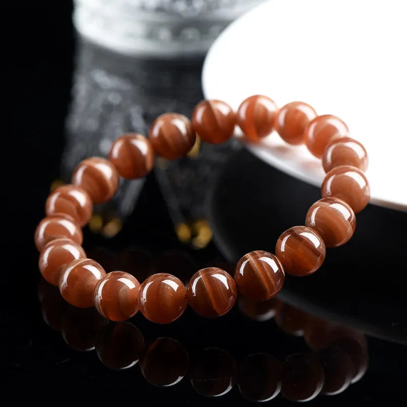 Natural old mine rhodochrosite round bead bracelet with geometric design and ruyi elements