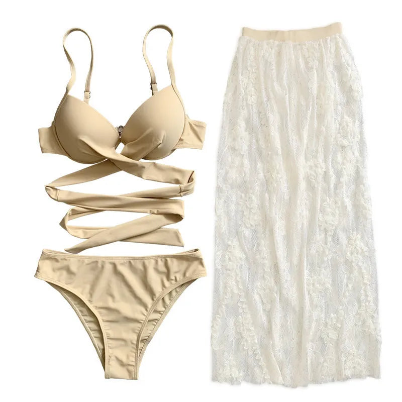 Three-piece backless push-up bikini set in solid colour with top, panties, and skirt.