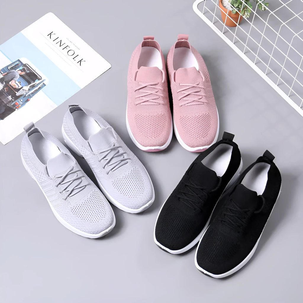 Women's black mesh casual sneakers with round toe, lace-up front, and a soft PVC sole.