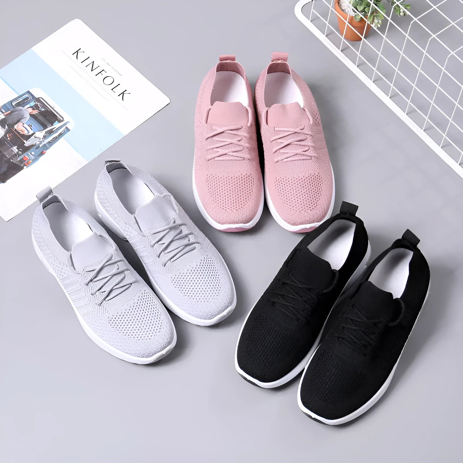 Women's black mesh casual sneakers with round toe, lace-up front, and a soft PVC sole.