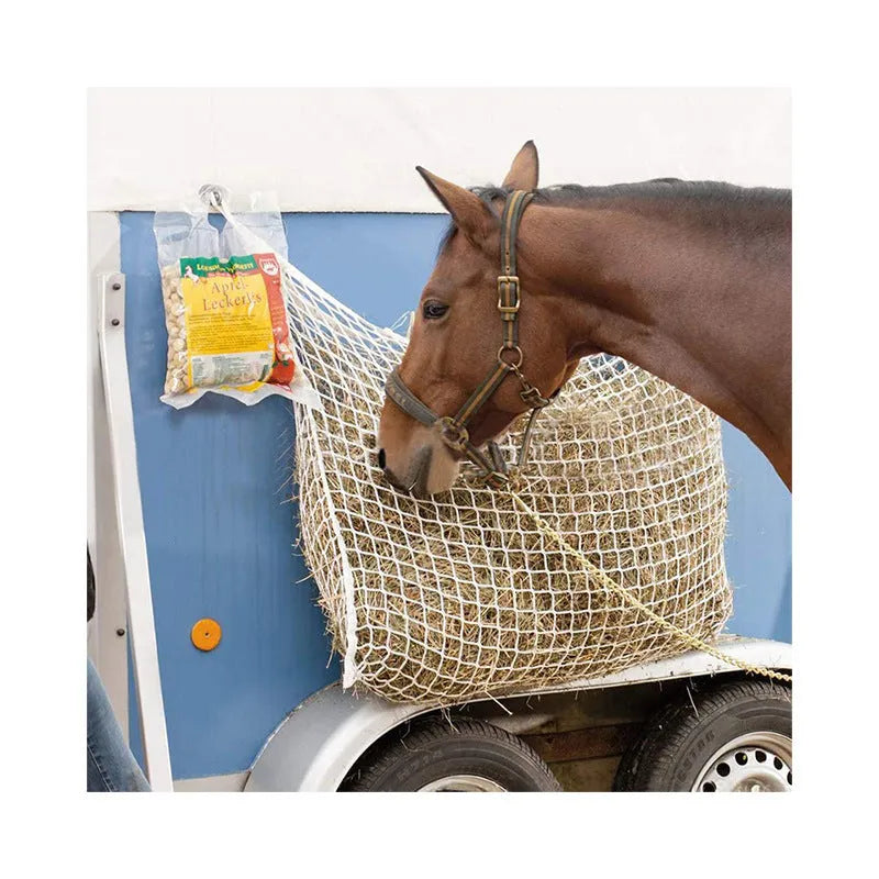 Woven grid horse feeding bag in black or white colours with hanging straps for livestock feeding
