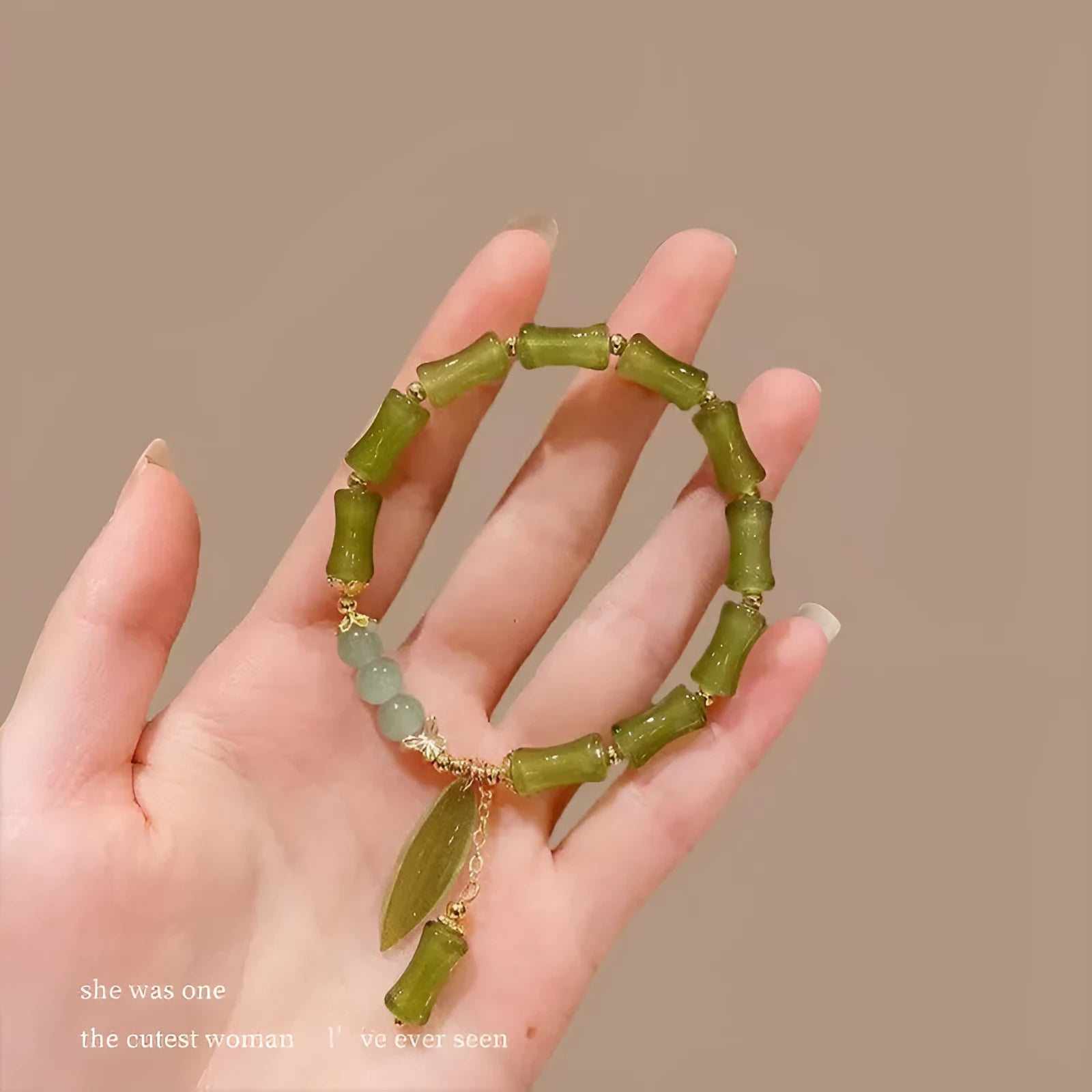 Handmade Chinese style glass bracelet with bamboo joint beads in a red Lvzhu Duobao design.