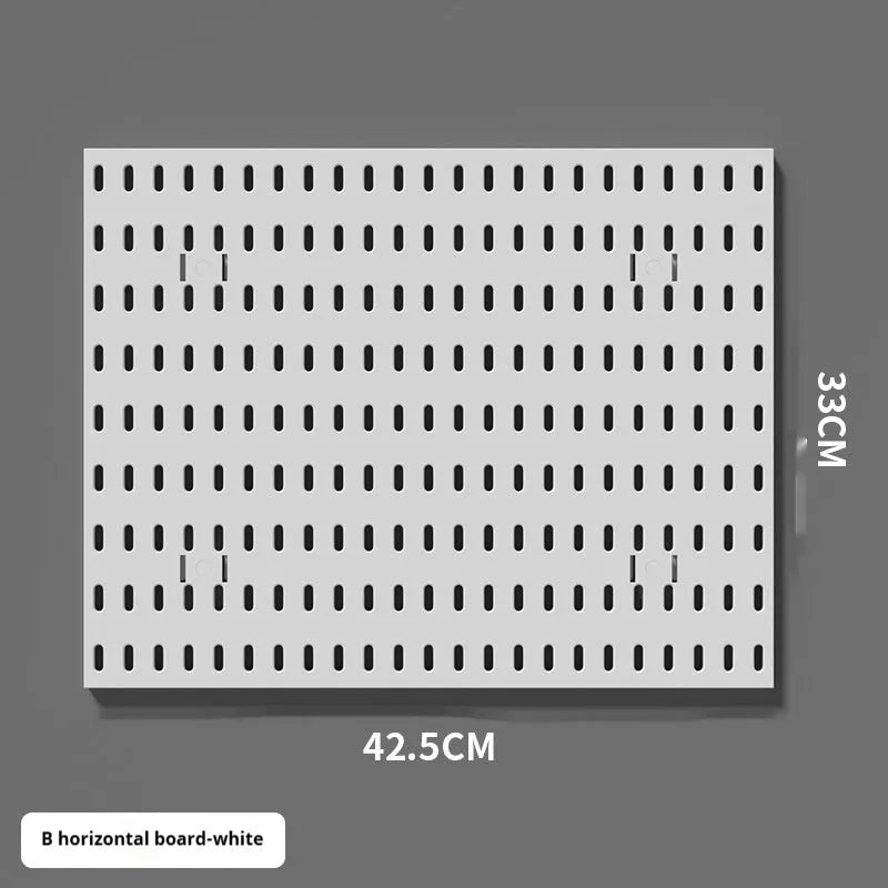 White punch-free plastic wire-wrap board storage rack mounted on a wall with hooks