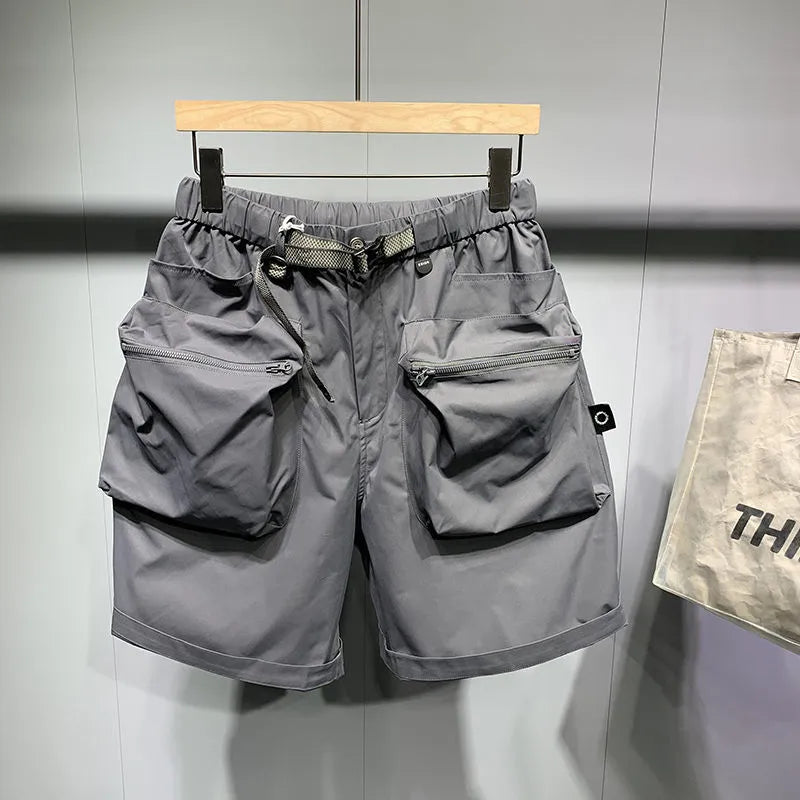 Men's loose fit work shorts in black or grey with pockets and non-iron treatment