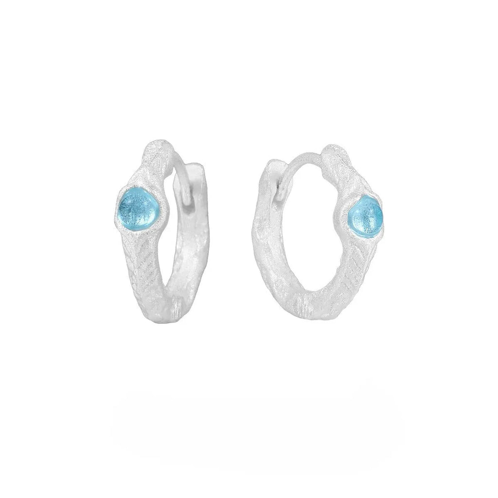 Geometric round ear clip in burnt silver tone, made from 925 silver with a clip-on back.