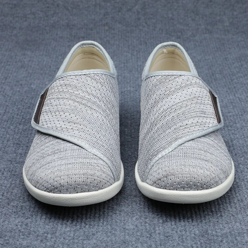 Beige leisure shoe with a velcro strap closure and a rounded toe, shown on a neutral background
