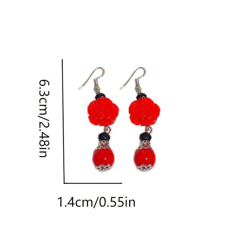 Copper butterfly stud earrings with rhinestone and diamond finish in red colour for women