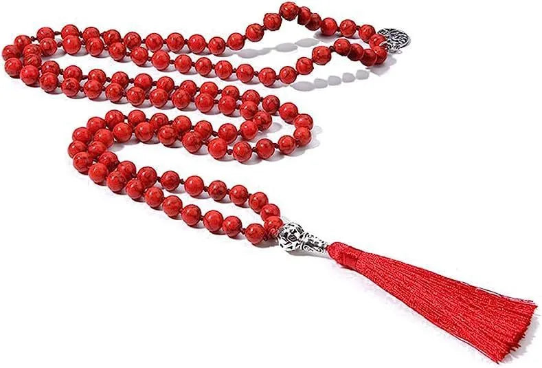Handmade knotted beaded necklace with stone pendant showing 108 beads and geometric design