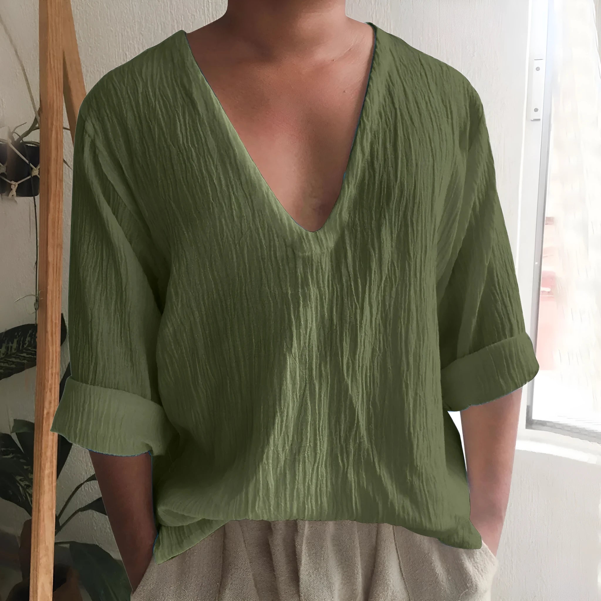 Men's solid colour V-neck long sleeve t-shirt in washed cotton fabric on a hanger