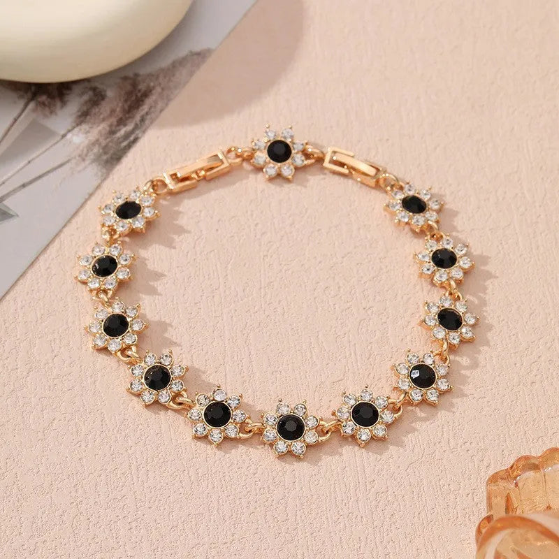 Zinc alloy flower bracelet with electroplated colour finish and colourful crystal decorations in gold and silver variations