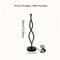 Black aluminium desk lamp with touch dimming controls and USB power cable