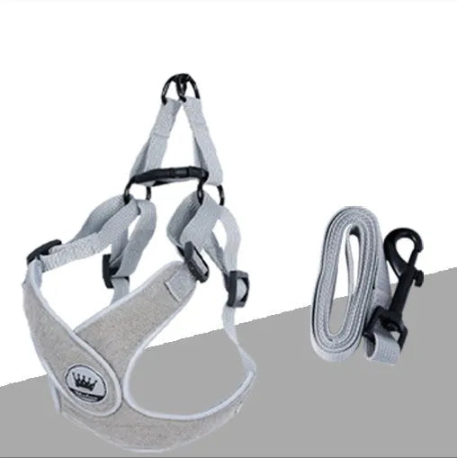 Green adjustable mesh dog harness with reflective strips and a metal D-ring on a dog.