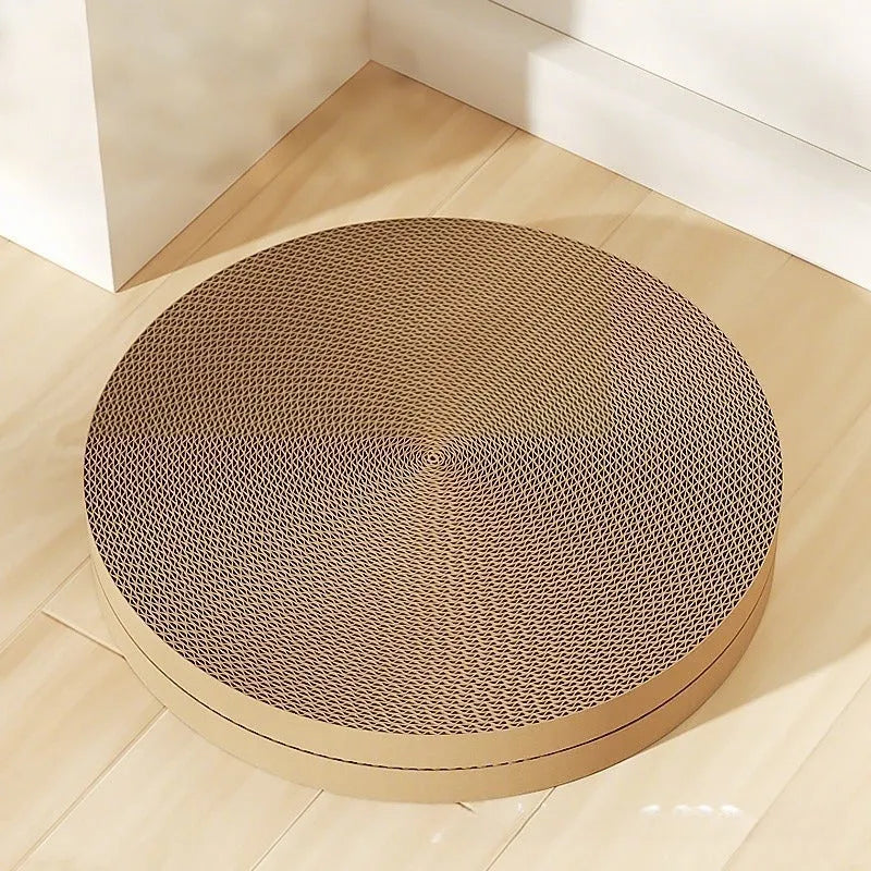 Round green cat scratching board with corrugated cardboard centre measuring 55cm diameter