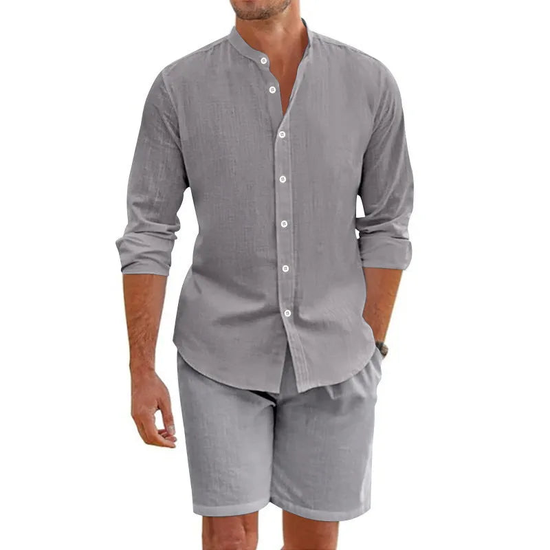 Men's light blue linen blend short sleeve button-down shirt and drawstring shorts suit set for summer.