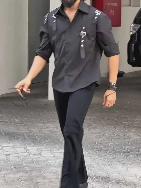 Men's black utility-style button-up shirt with a regular fit on a model.