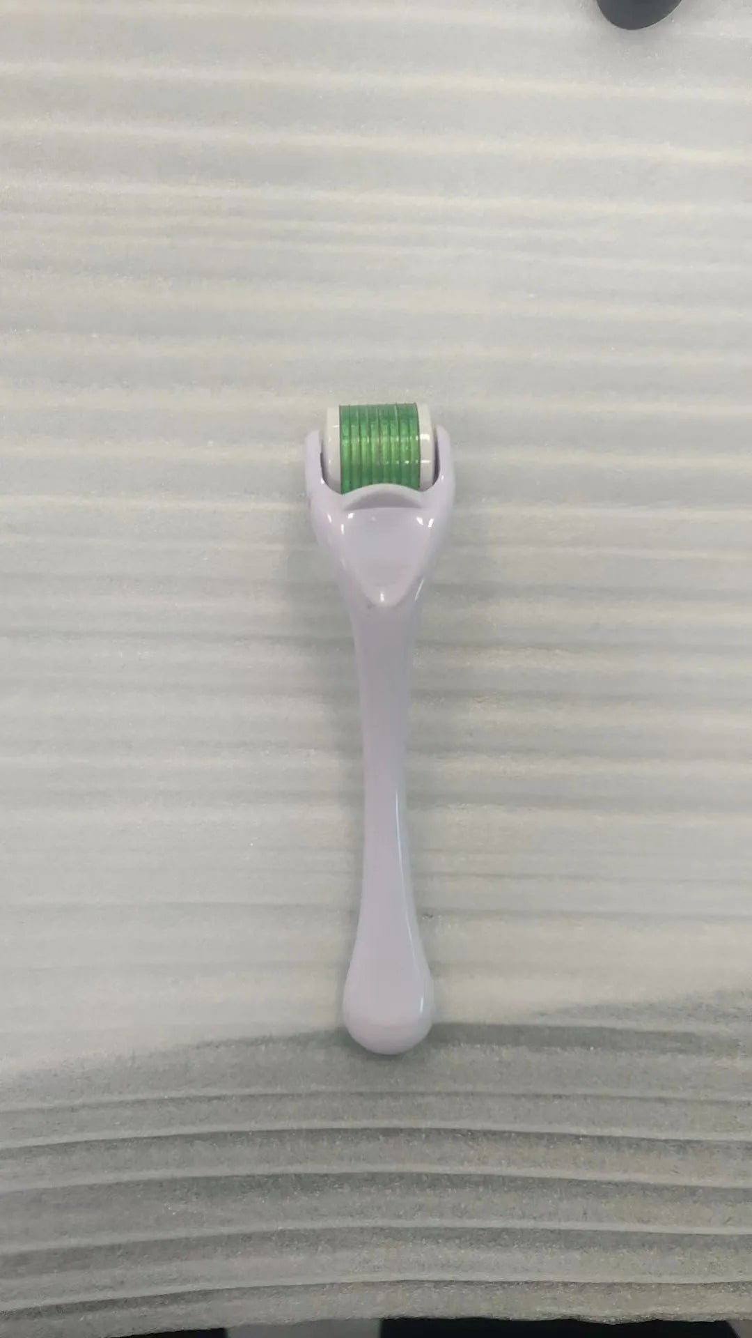 Sterile micro needle derma roller with PC handle in selected colour and 0.2mm, 0.25mm, or 0.3mm needle wheel.