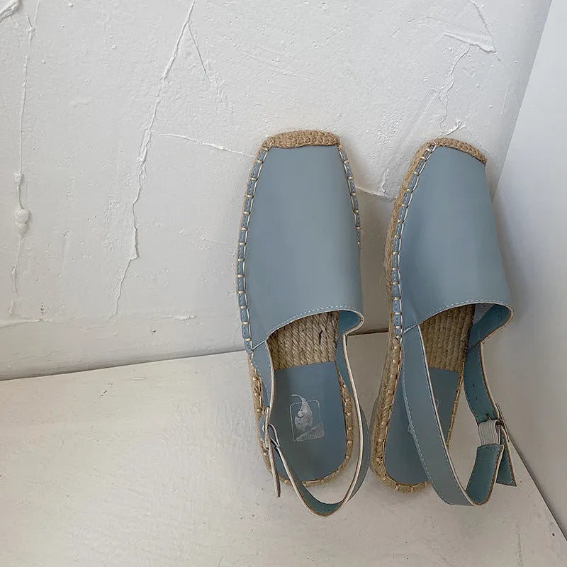 Women's beige retro fisherman flat sandals with canvas upper and animal pattern.