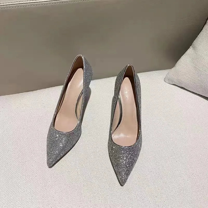 Women's silver PU leather bridal shoes with crystal detail on a stiletto heel.