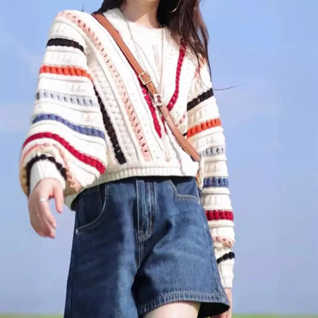 Rainbow striped pullover sweater with batwing sleeves and round neck in loose fit casual style
