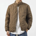 Men's black diamond pattern winter jacket with loose fit and elongated length