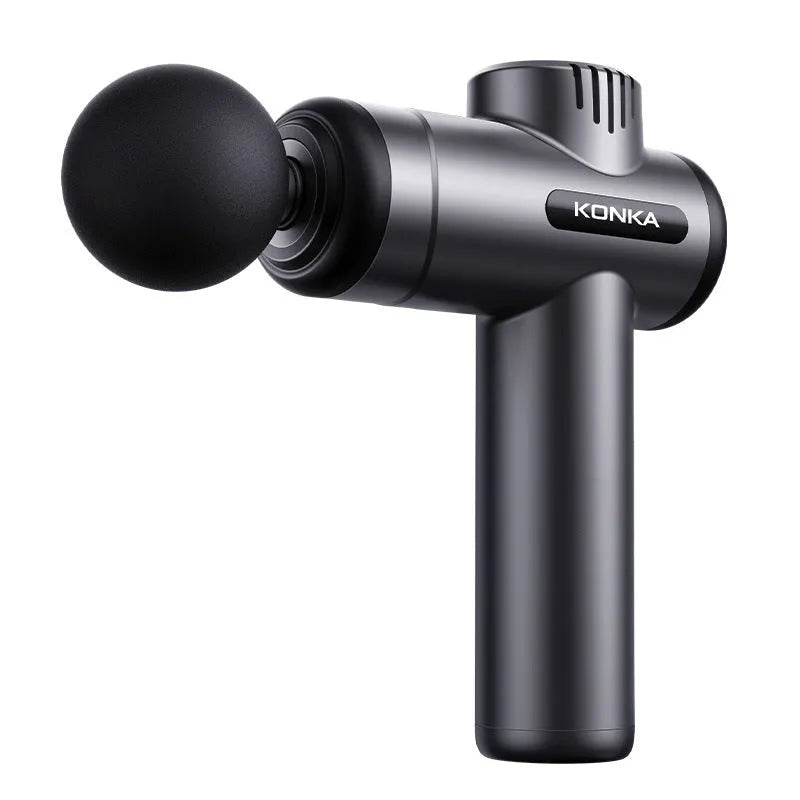 Konka V19 grey mini electric massage gun with multiple attachment heads on a table