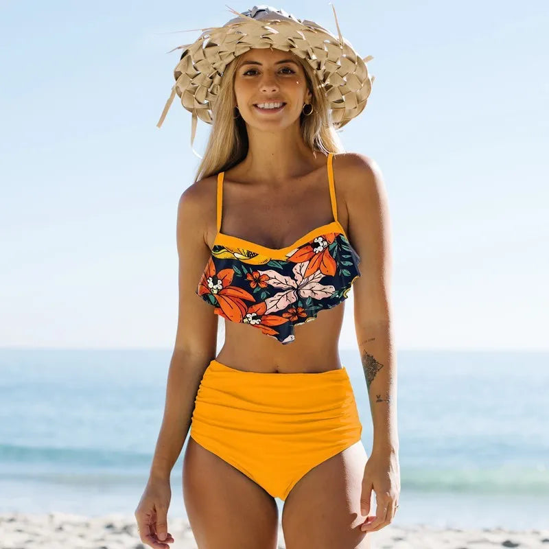 Women's high waist floral print split bikini swimsuit in blue, shown on model.