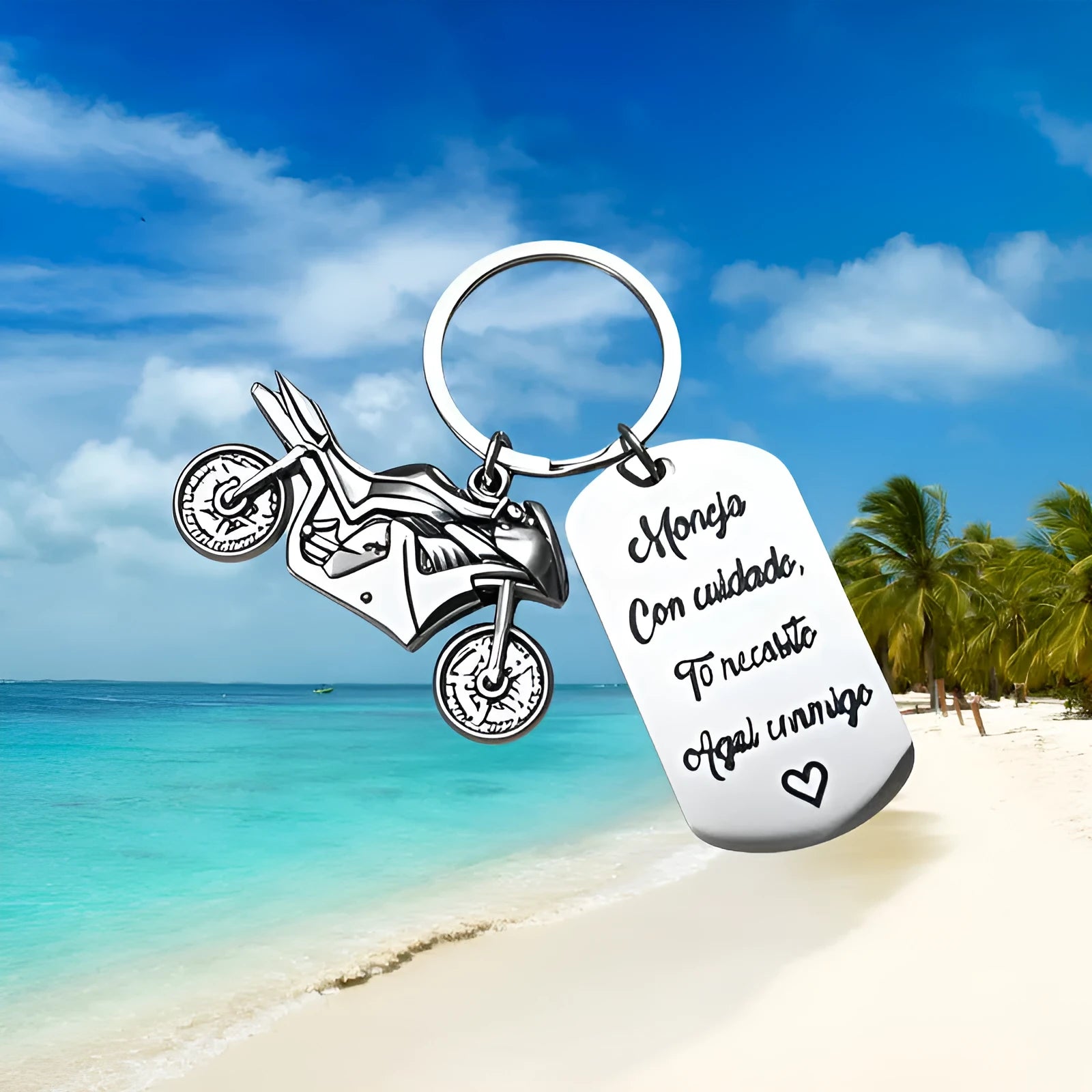 Stainless steel key ring with detailed motorcycle design on metal surface