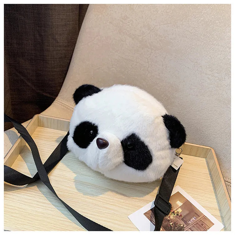 Cylindrical plush crossbody bag with panda head design showing outer sandwich pocket