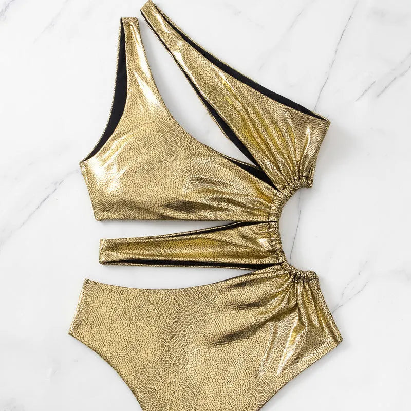 Women's C3177 gold backless one-piece swimsuit on a white background.