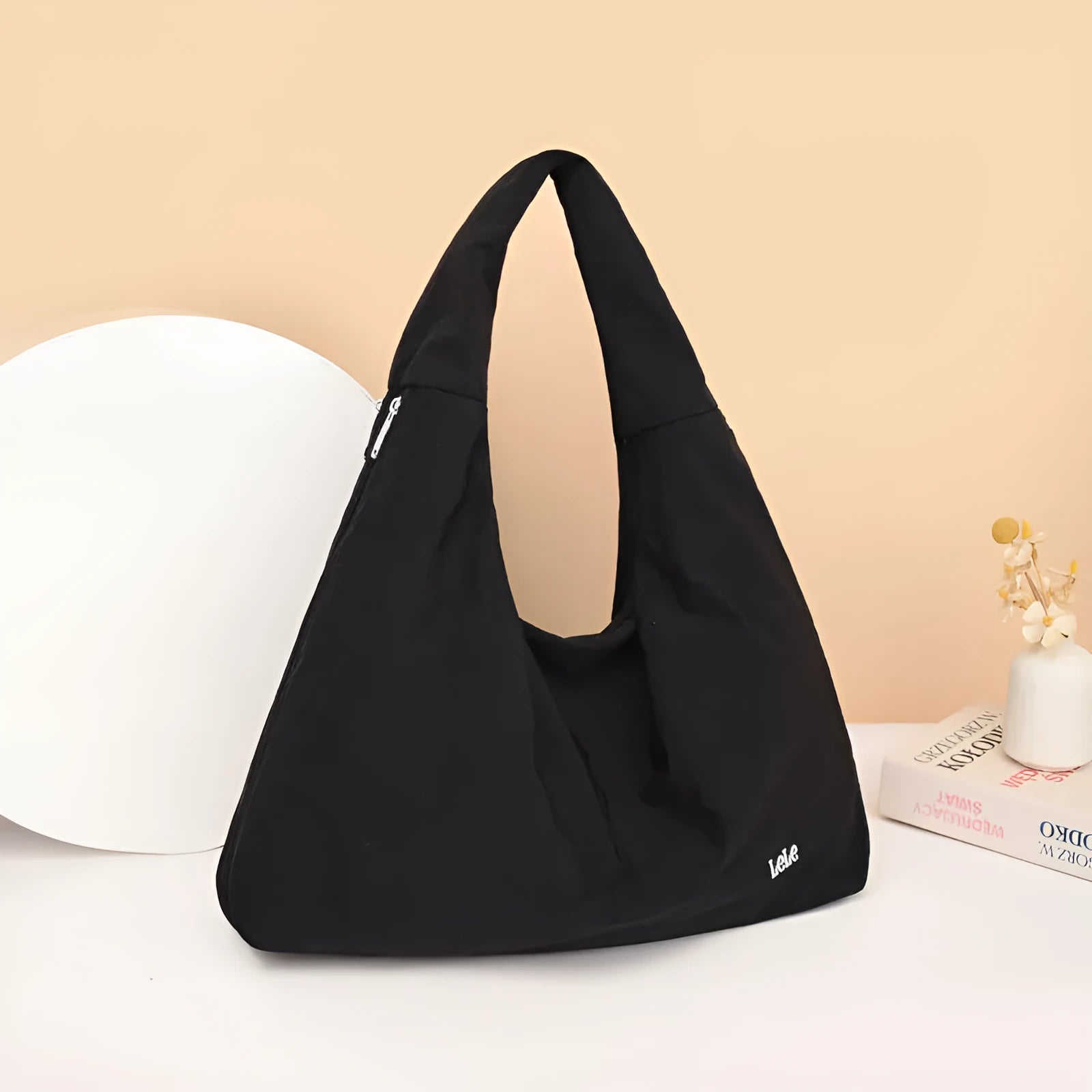 Soft nylon women's underarm bag in a heart shape, shown in black, blue, khaki, and yellow colours.