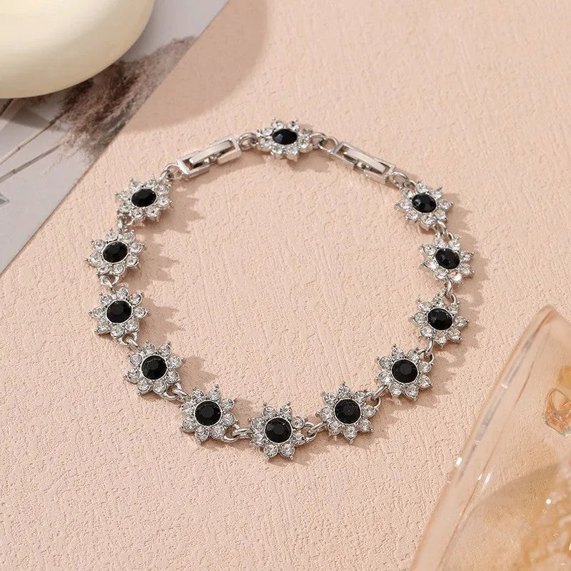 Zinc alloy flower bracelet with electroplated colour finish and colourful crystal decorations in gold and silver variations
