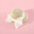 Woven straw hat for a cat with a pearl butterfly bow, shown in pink, purple, blue, or white colour options.