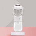Portable blue dog water bottle with integrated drinking bowl showing split water grain design