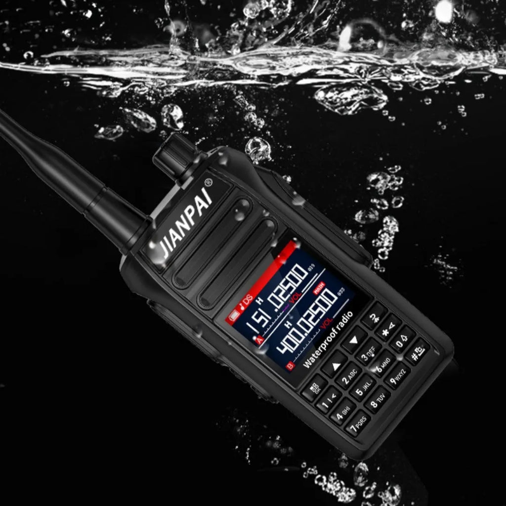 Black Interphone aviation communication headset with microphone, battery, antenna, and charging accessories on a flat surface.