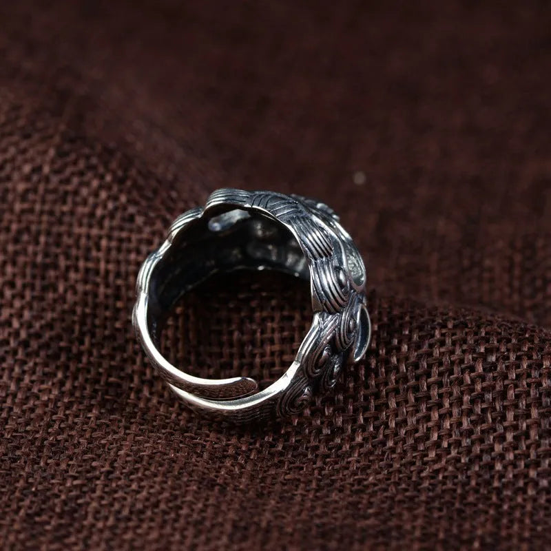 Silver open ring with detailed jibeast animal zodiac pattern and diamond details