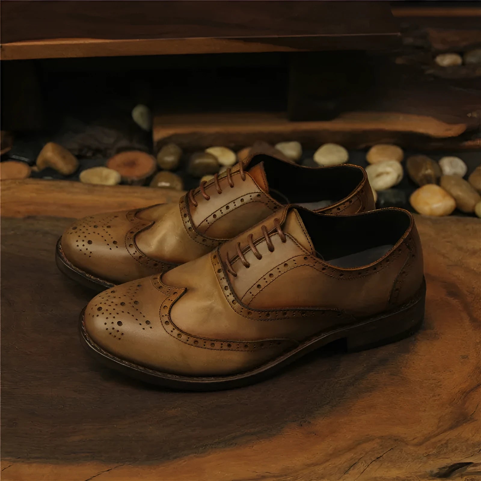 Light brown men's vintage distressed leather shoes with engraved detailing, round toe, and lace-up front.
