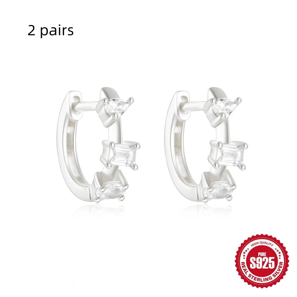 Sterling silver geometric stud earrings with small round diamond accents in gold or silver electroplated finish