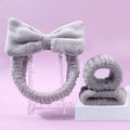 Facial brush set with coral fleece hair band, nylon bristle brush, and plastic toothbrush in purple, grey, white, or pink colours