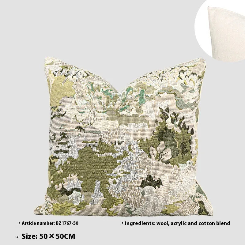 Green abstract floral wool blend decorative cushion on a neutral background.