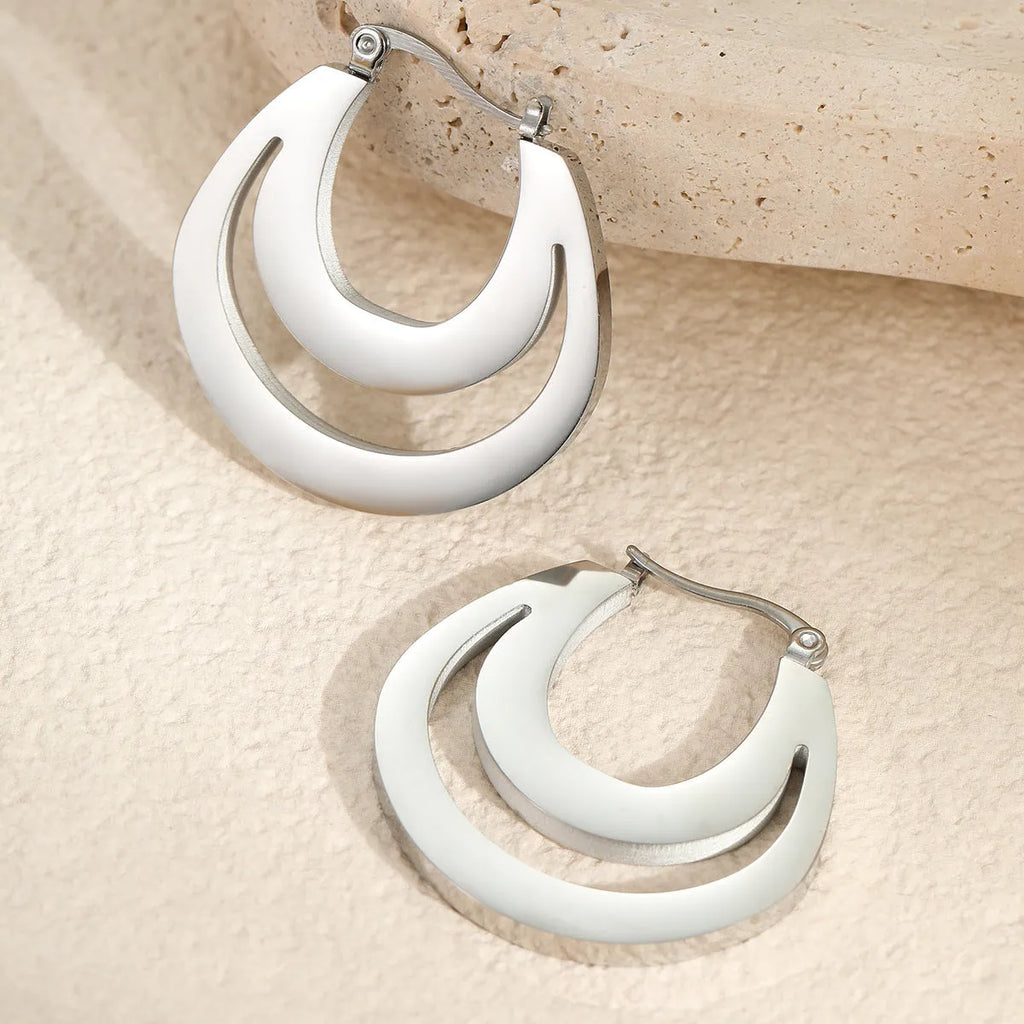Geometric French earrings with circular ring elements in 18K gold plated metallic finish