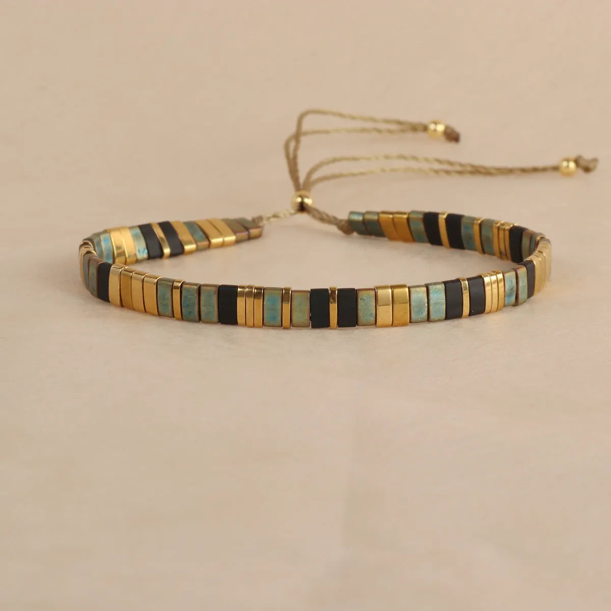 Glass and coloured glaze beaded bracelet with geometric round beads in five colour options