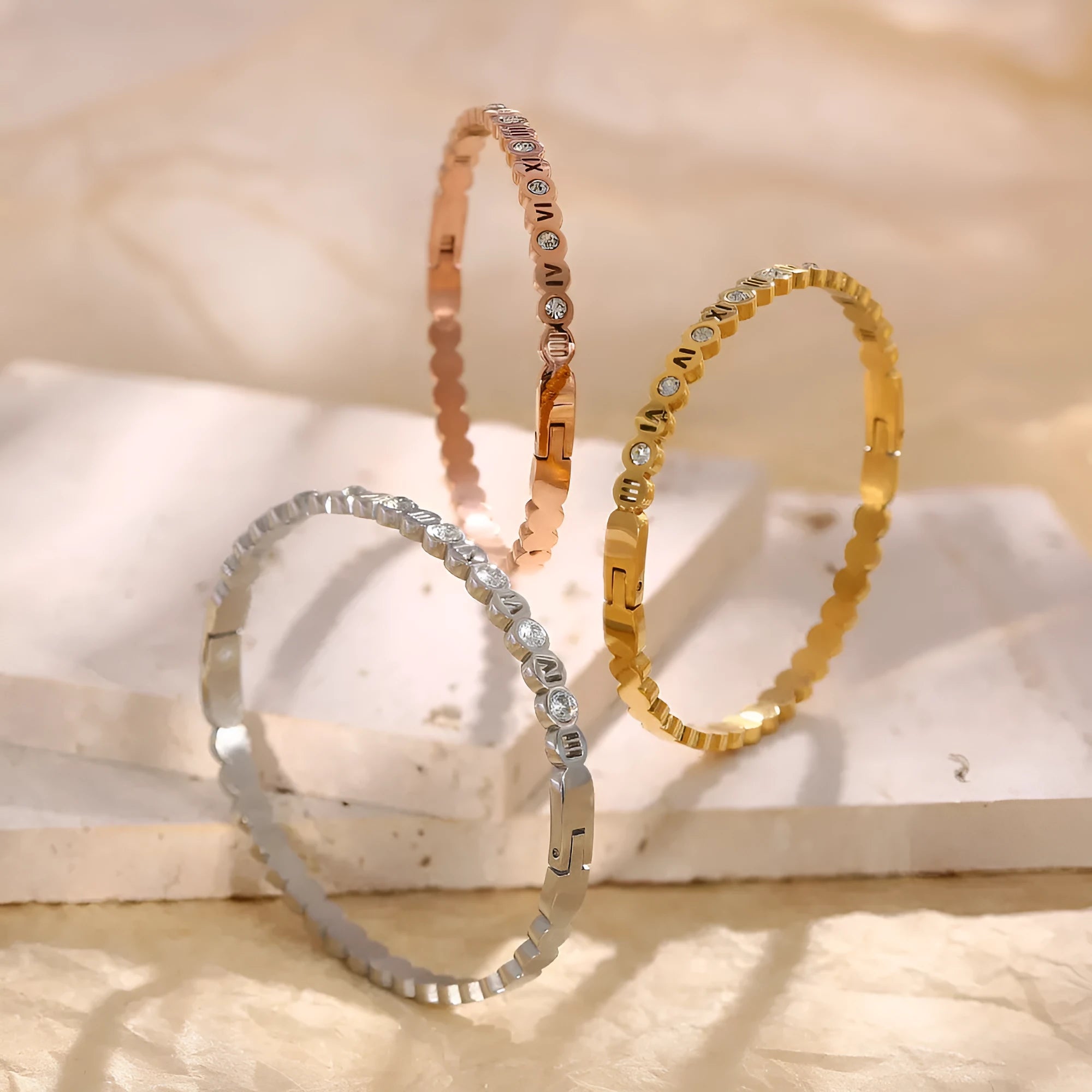 Korean style titanium steel bracelet with a numeric charm, shown in gold, rose gold, and steel colour options.
