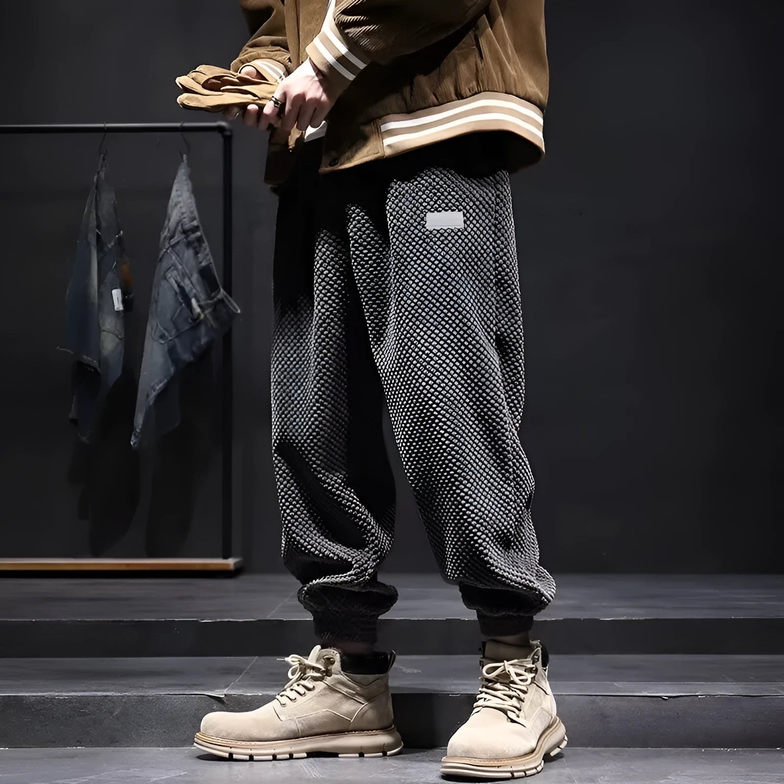 Men's grey ankle-tied straight leg sweatpants with elastic waist on a white background.