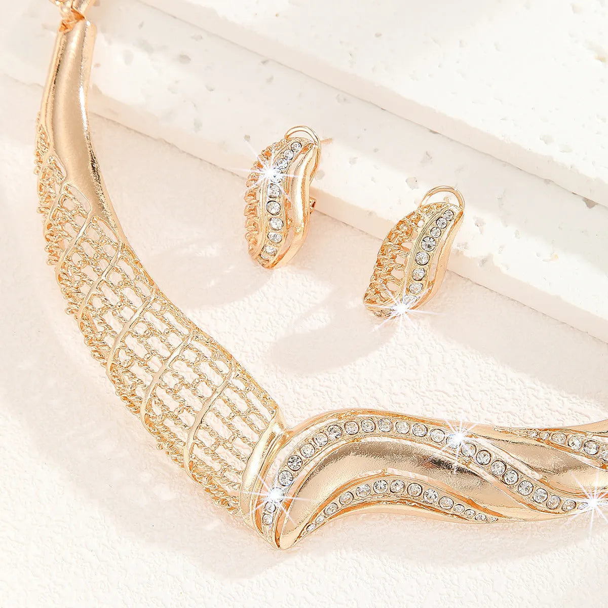 Gold alloy necklace and earrings set for women with electroplated finish and pattern options